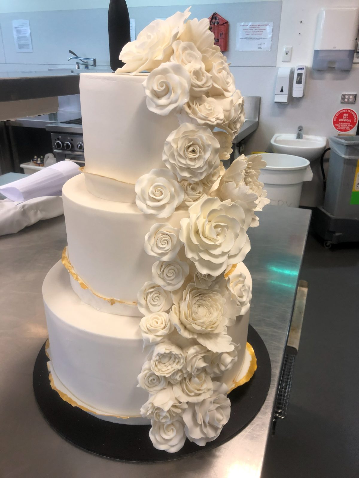 Award-winning three-tier wedding cake with sugar roses