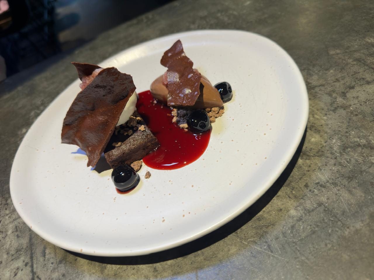 Dark chocolate crémeux with morello cherry and berry coulis