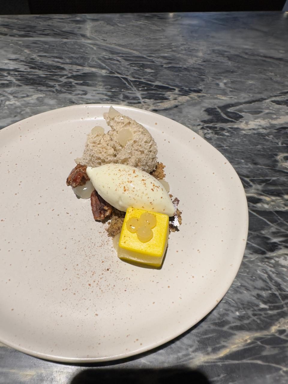 Coconut parfait with citrus gel and candied pecan
