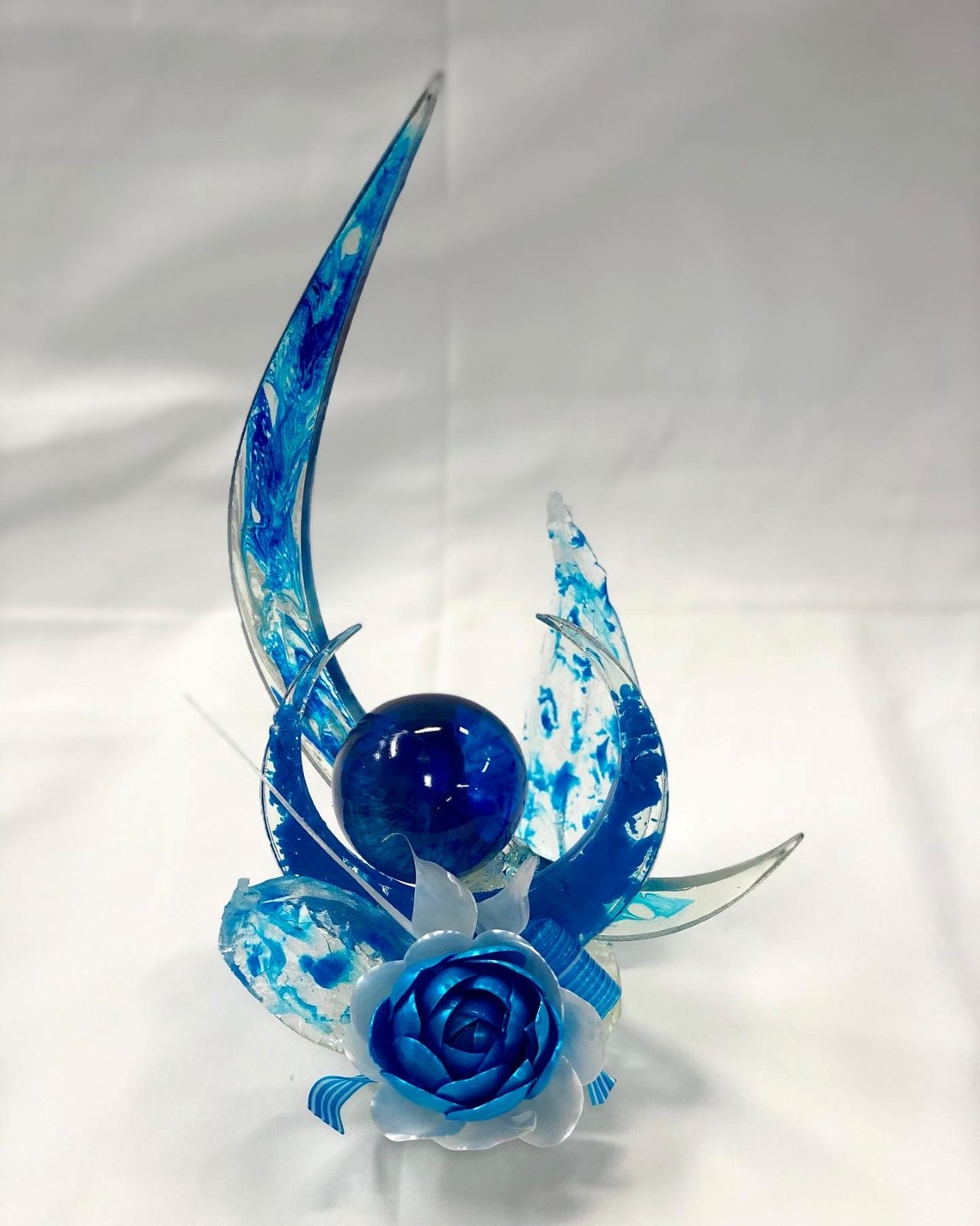Blue pulled sugar showpiece with blown sugar sphere